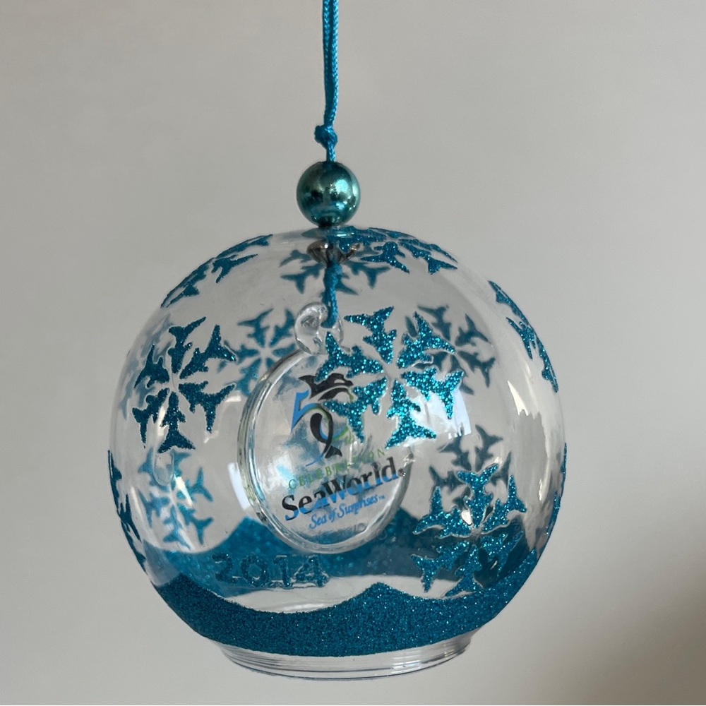 Sea World 50th Anniversary Sea of Surprises 2014 Blue Glitter Glass Ornament